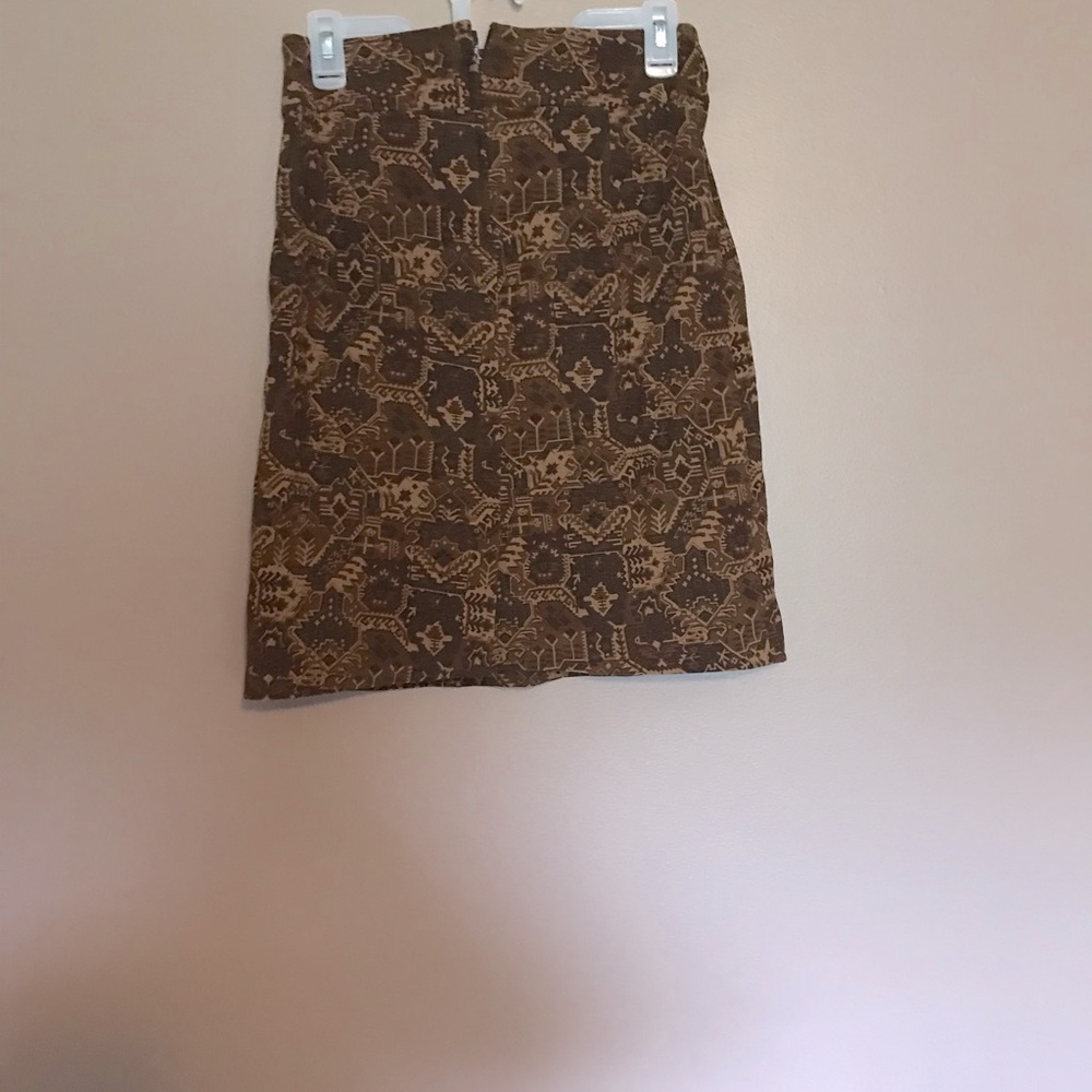 Mid thigh length leopard print skirt.